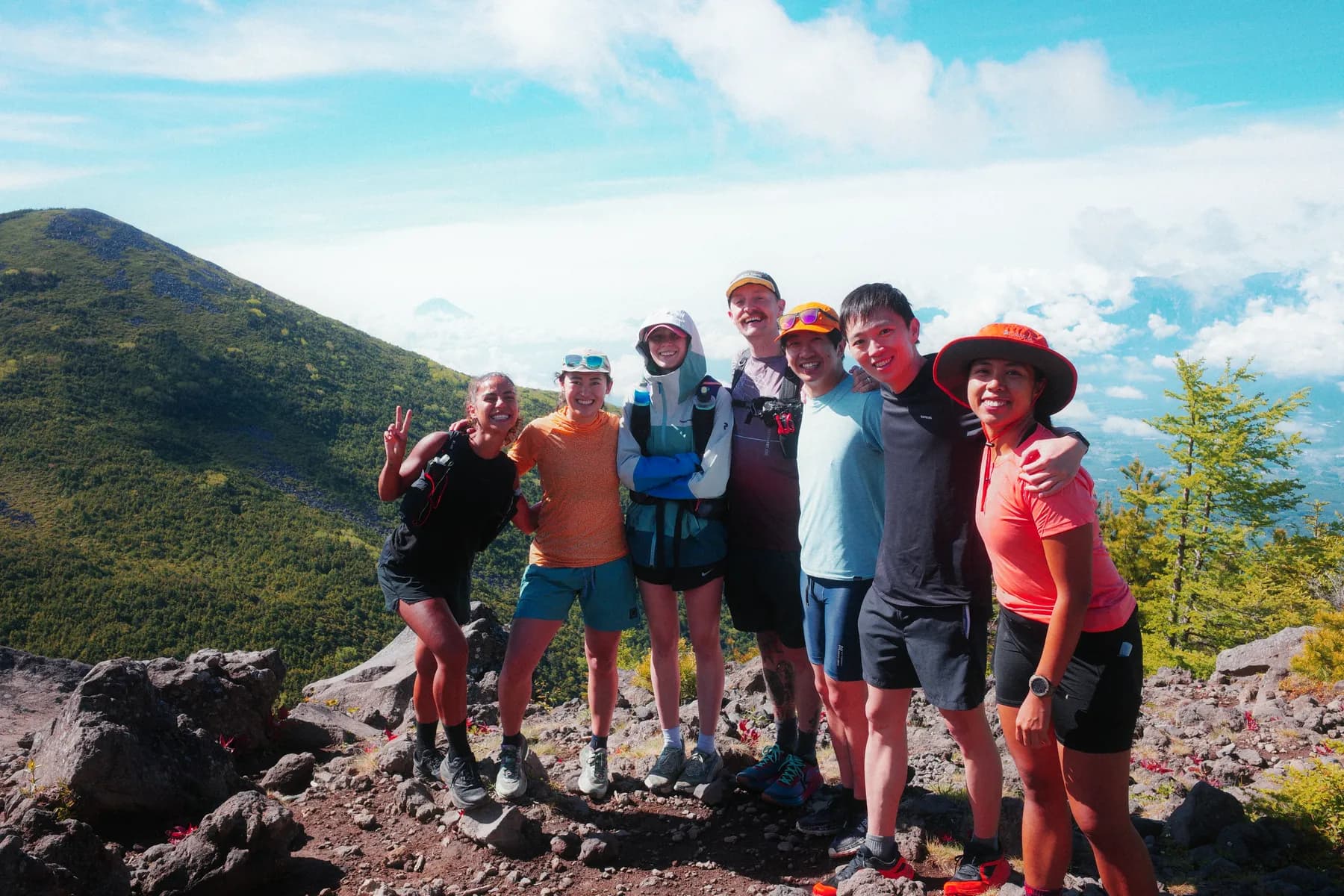 The group together on a volcanic summit