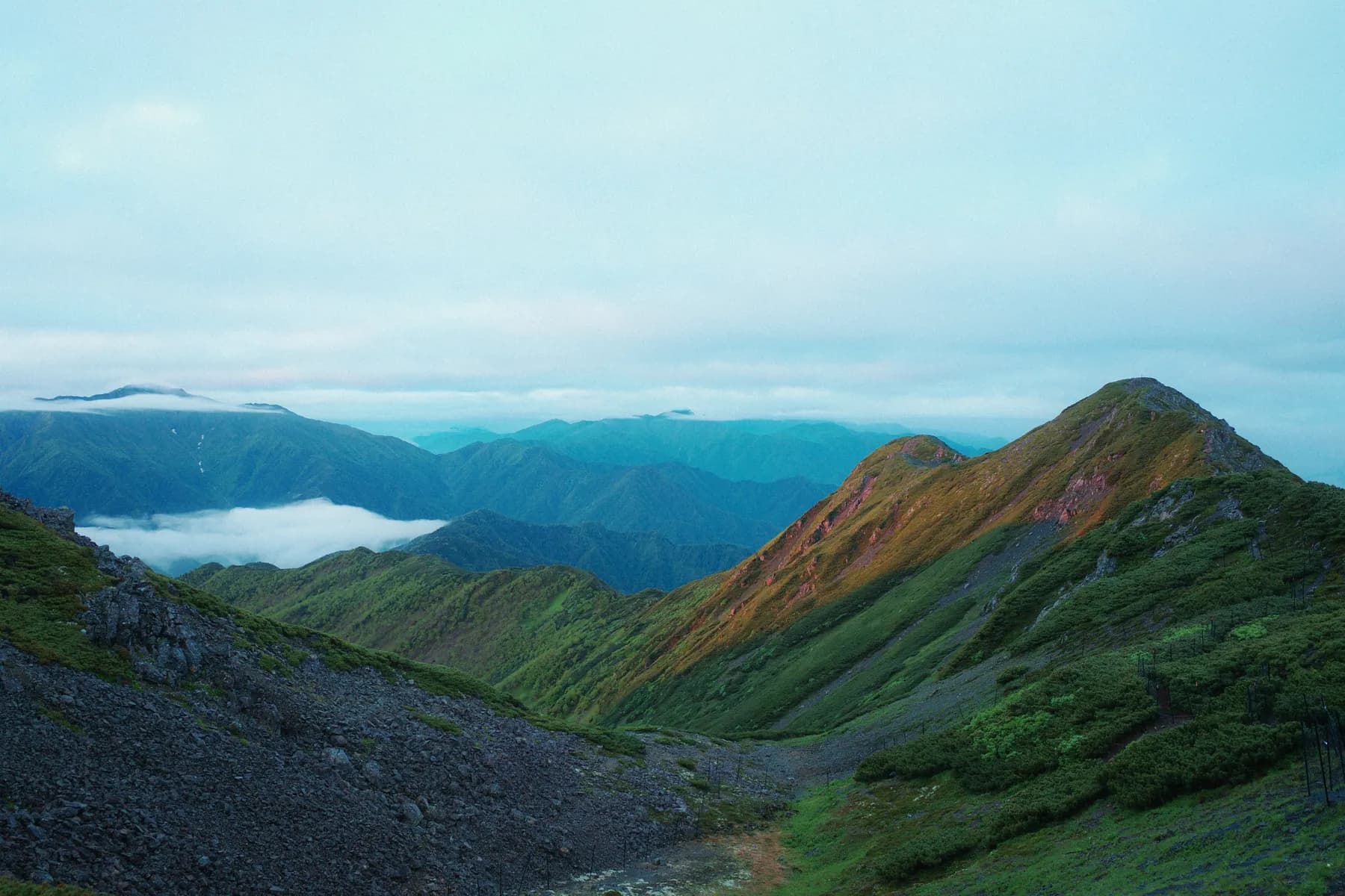 A mountain vista with rolling cloud