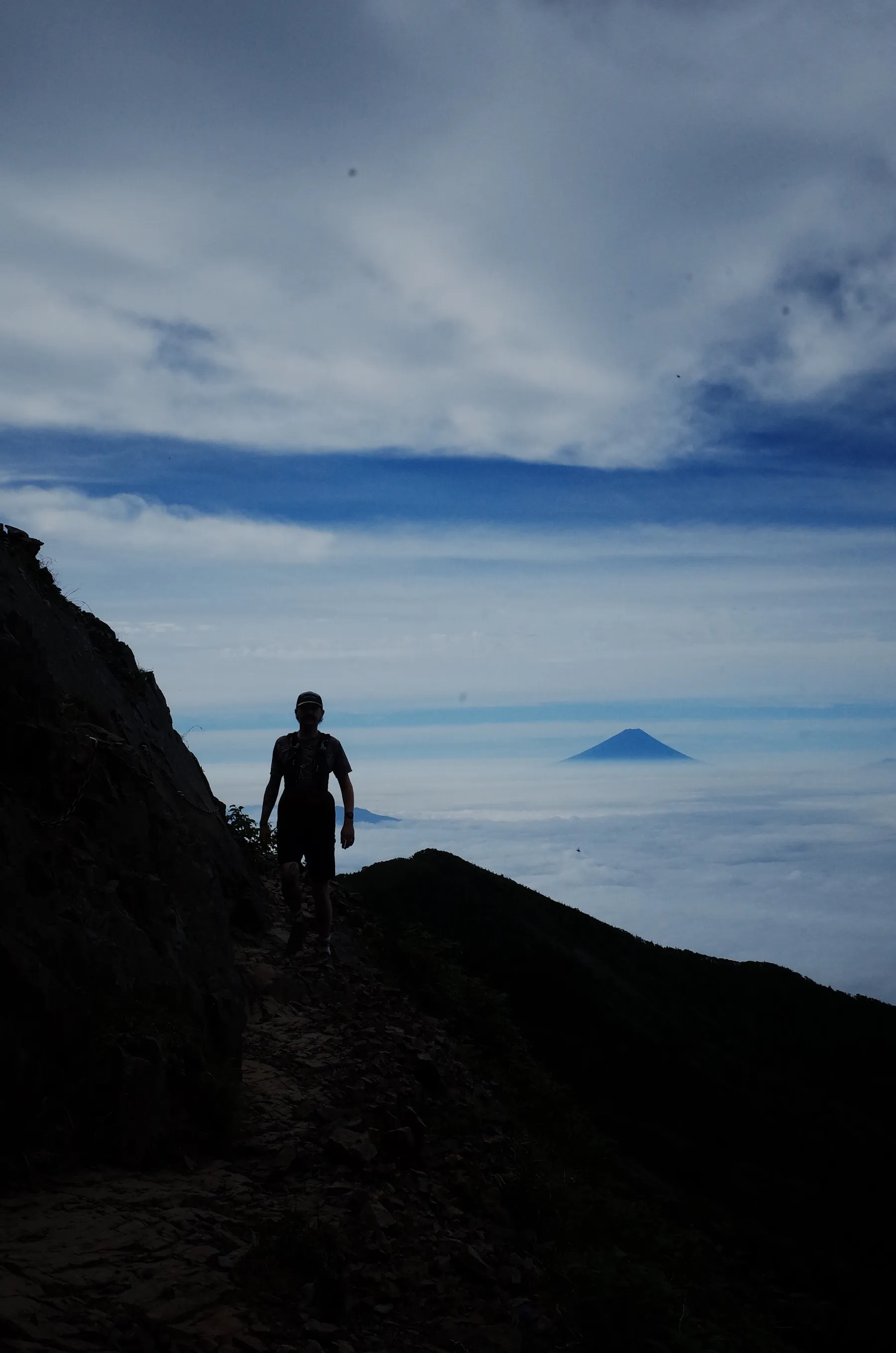 A runner silhouetted against Mt. Fuji at dawn
