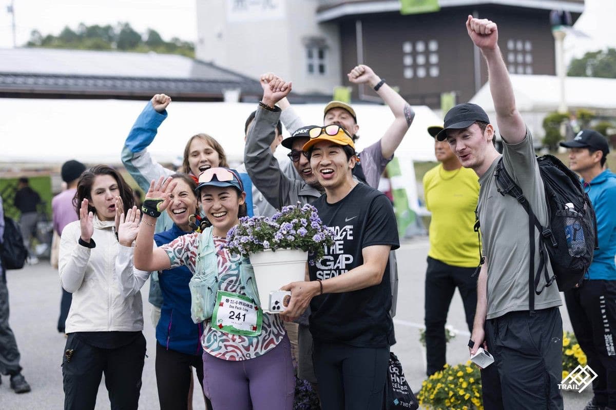 Runners celebrating together at a race finish
